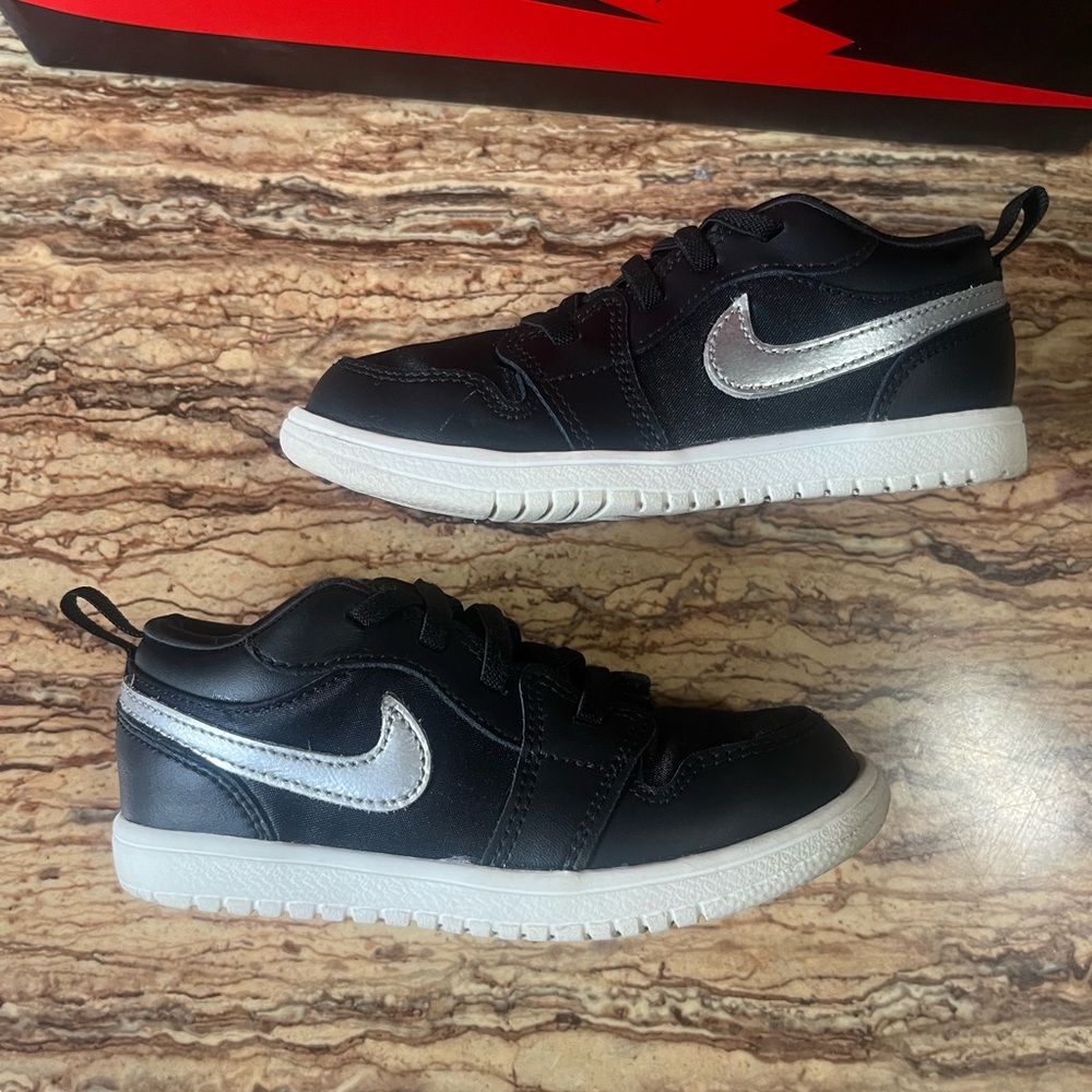 Jordan 1 Low Kids Black and Silver Low-Top Sneakers
